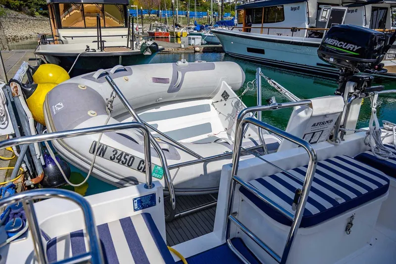 Slide: The Image of Nord Star 28 Patrol 2019 docked with inflatable boat and Mercury motor. - 14