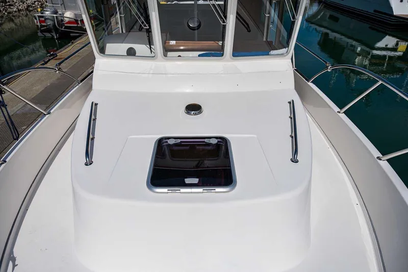 Slide: The Image of 2019 Nord Star 28 Patrol boat deck with hatch and railing in marina. - 22