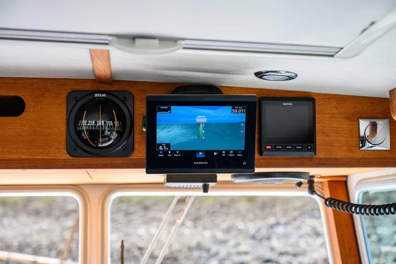 Slide: The Image of Interior of 2019 Nord Star 28 Patrol boat with navigation equipment and compass. - 35