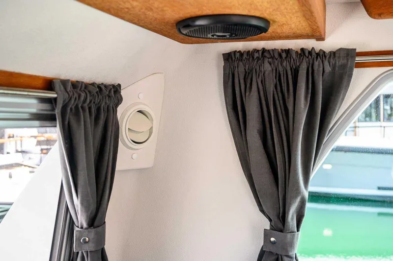 Slide: The Image of Interior of 2019 Nord Star 28 Patrol with dark curtains and window vent. - 36