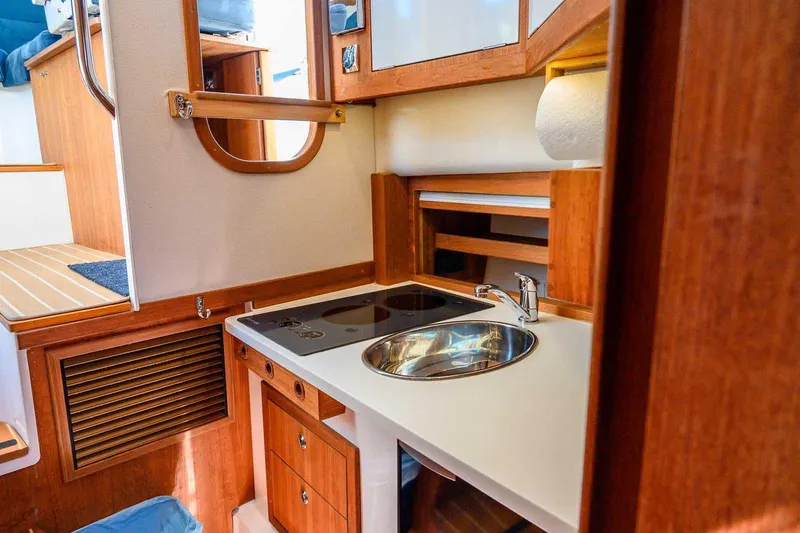 Slide: The Image of Compact kitchen area in 2019 Nord Star 28 Patrol boat with sink and stove. - 37