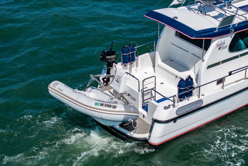 Slide: The Image of 2019 Nord Star 28 Patrol boat with Zodiac dinghy on water. - 7