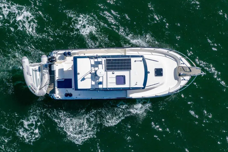 Slide: The Image of Aerial view of 2019 Nord Star 28 Patrol boat navigating through green waters. - 9