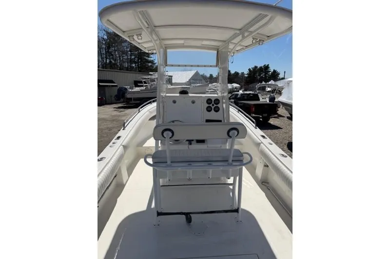 Slide: The Image of 2004 Regulator 24 Forward Seating boat with center console and seating area. - 7
