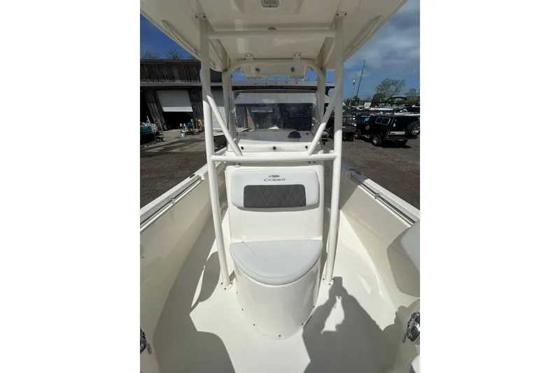 Slide: The Image of 2022 Cobia 220 Center Console boat interior with seating and console view. - 21