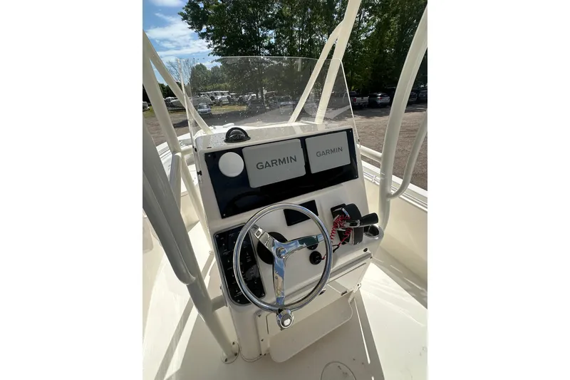 Slide: The Image of 2022 Cobia 220 Center Console boat dashboard with Garmin navigation system. - 36