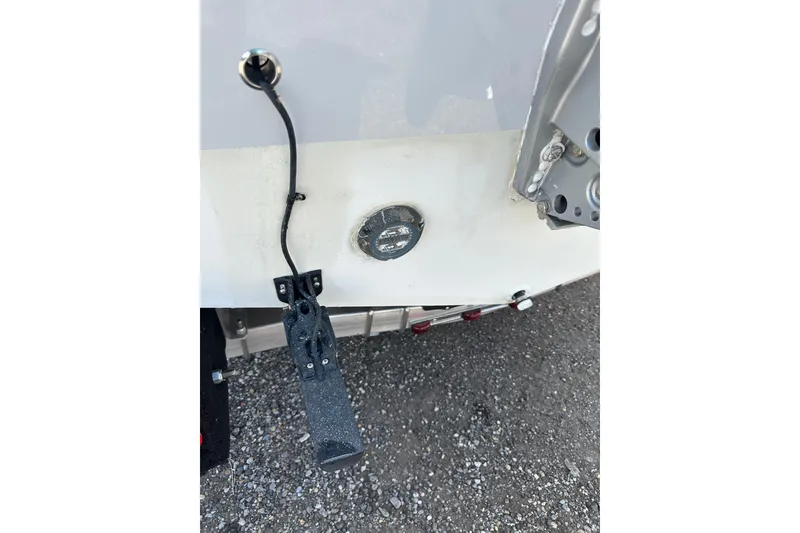 Slide: The Image of 2022 Cobia 220 Center Console boat transom with mounted sensor and wiring. - 37