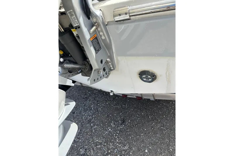 Slide: The Image of 2022 Cobia 220 Center Console boat detail showing engine mount and hull. - 38