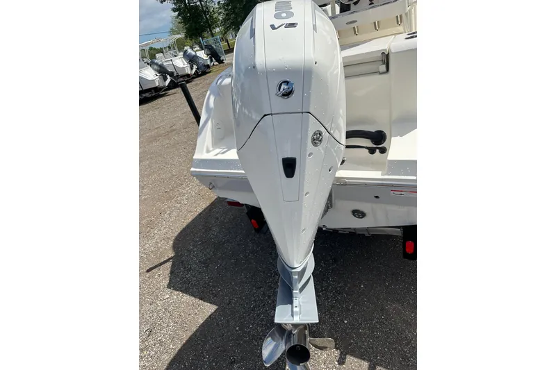Slide: The Image of 2022 Cobia 220 Center Console boat with powerful V8 outboard engine. - 5