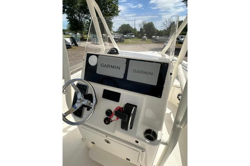 Slide: The Image of 2022 Cobia 220 Center Console boat dashboard with Garmin navigation system. - 9