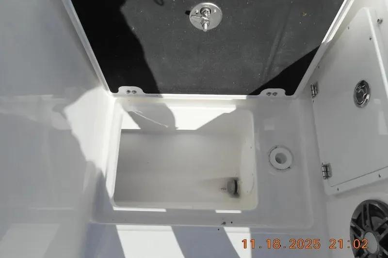 Slide: The Image of Storage compartment on 2026 Sea Fox 268 Traveler boat, featuring secure latch and clean interior. - 13