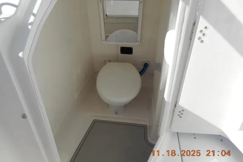 Slide: The Image of 2026 Sea Fox 268 Traveler boat interior bathroom with toilet and mirror. - 19