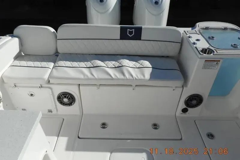 Slide: The Image of 2026 Sea Fox 268 Traveler boat seating area with speakers and storage compartments. - 22