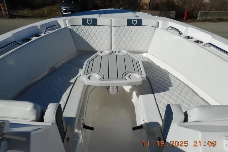 Slide: The Image of Interior view of 2026 Sea Fox 268 Traveler boat with cushioned seating and table. - 24