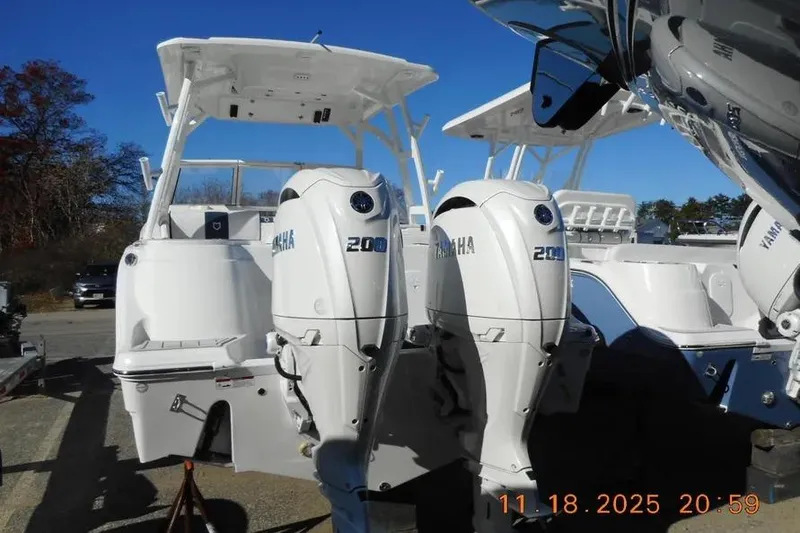 Slide: The Image of 2026 Sea Fox 268 Traveler boat with twin Yamaha 200 engines, docked outdoors. - 3