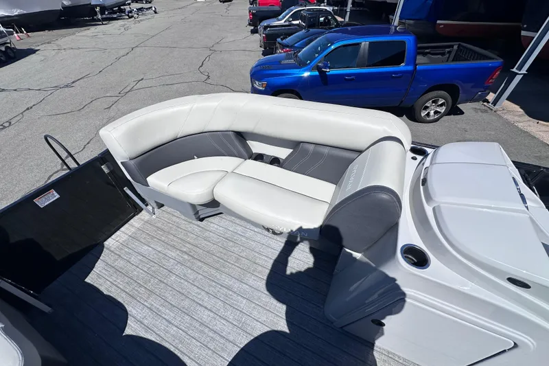 Slide: The Image of 2021 Sylvan Mirage X X3 pontoon boat interior with gray seating and cup holders. - 16