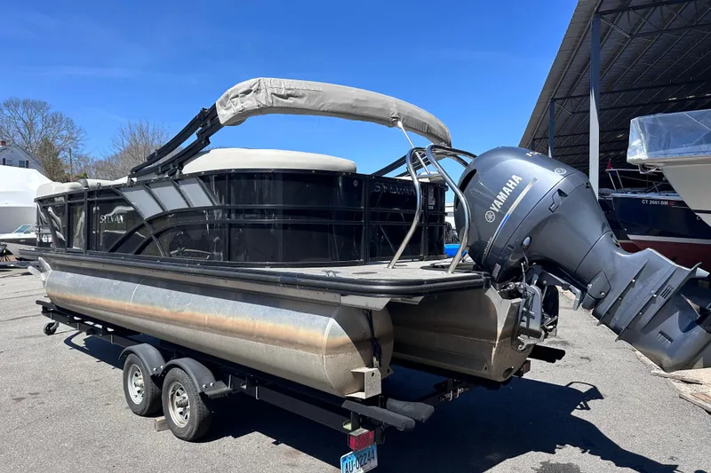 Slide: The Image of 2021 Sylvan Mirage X X3 pontoon boat with Yamaha outboard motor on trailer. - 2