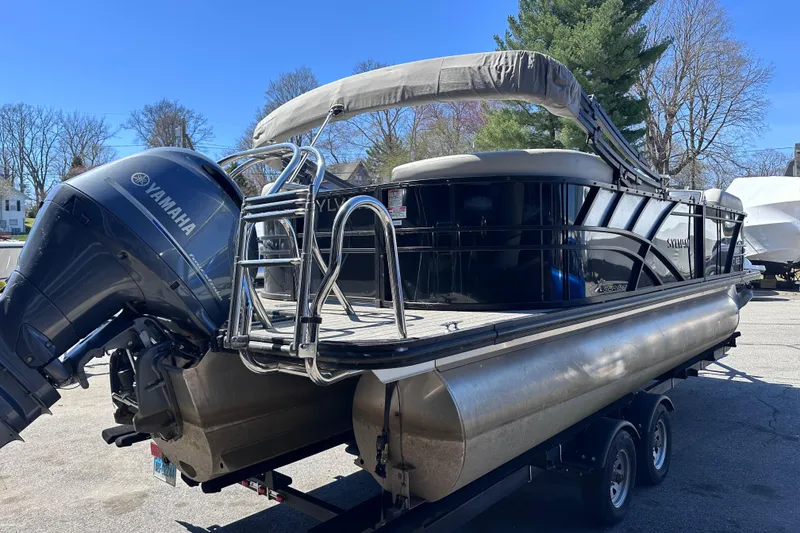 Slide: The Image of 2021 Sylvan Mirage X X3 pontoon boat with Yamaha outboard motor on trailer. - 3