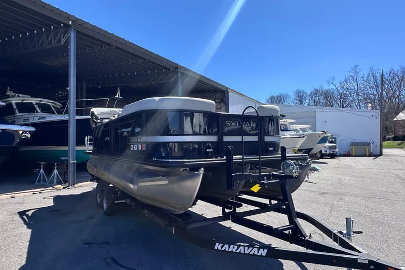 Slide: The Image of 2021 Sylvan Mirage X X3 pontoon boat on Karavan trailer in marina storage area. - 5