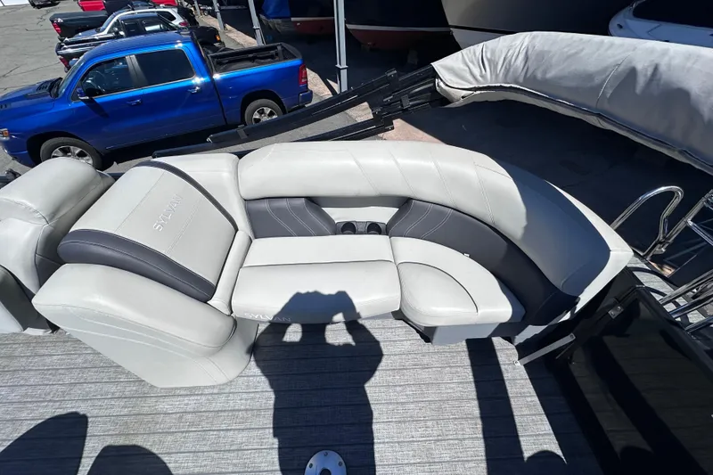 Slide: The Image of 2021 Sylvan Mirage X X3 boat with luxurious seating and sleek design. - 9