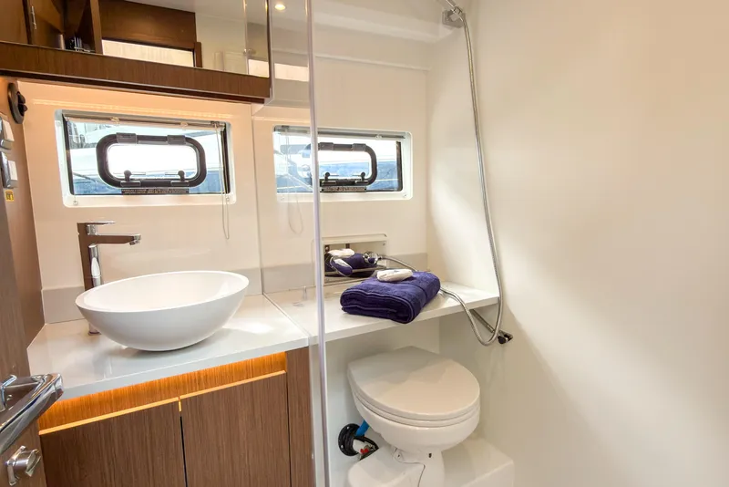 Slide: The Image of Luxurious bathroom in 2026 Beneteau Antares 12 Coupe yacht with modern fixtures. - 12