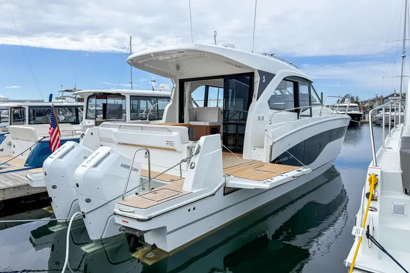 Slide: The Image of 2026 Beneteau Antares 12 Coupe yacht docked, showcasing sleek design and powerful engines. - 2