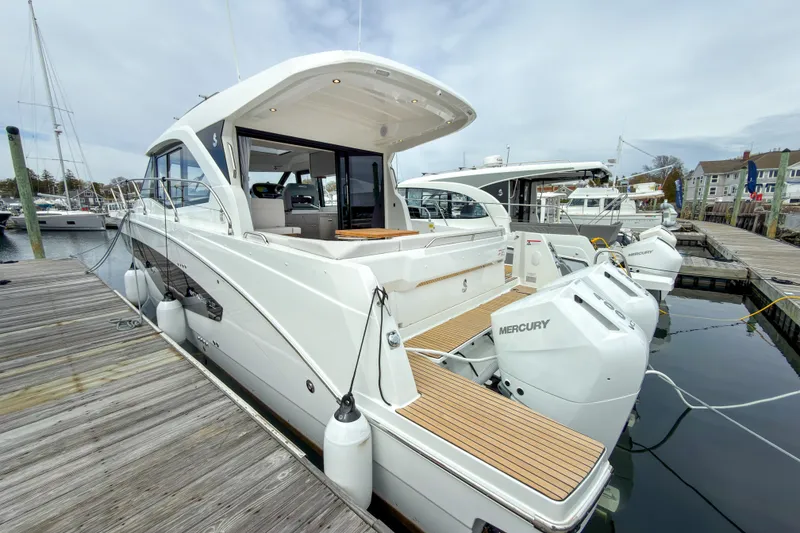 Slide: The Image of 2026 Beneteau Antares 12 Coupe docked, showcasing sleek design and powerful Mercury engines. - 3