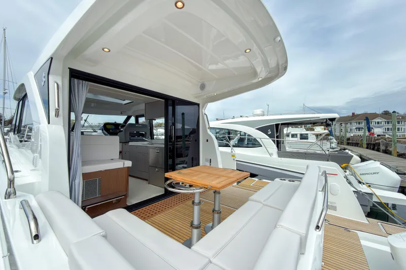 Slide: The Image of 2026 Beneteau Antares 12 Coupe yacht with open deck and modern interior design. - 4
