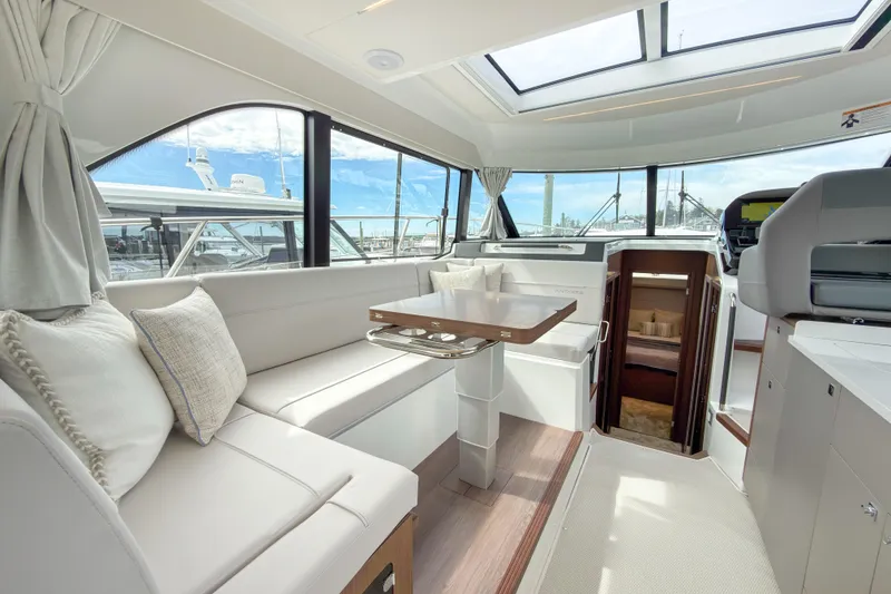 Slide: The Image of Luxurious interior of 2026 Beneteau Antares 12 Coupe with skylight and elegant seating. - 8