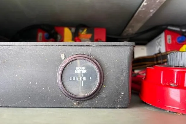 Slide: The Image of Hour meter on 1993 Sea Ray Sundancer 330, displaying engine hours. - 106