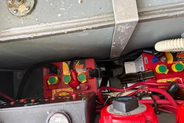 Slide: The Image of Battery compartment of a 1993 Sea Ray Sundancer 330 with wiring and connections. - 107