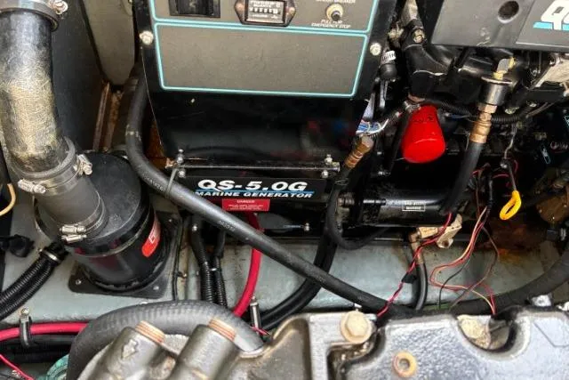 Slide: The Image of Engine compartment of a 1993 Sea Ray Sundancer 330 with QS-5.0G marine generator. - 111