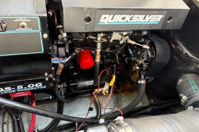 Slide: The Image of Engine compartment of a 1993 Sea Ray Sundancer 330 with Quicksilver marine generator. - 112