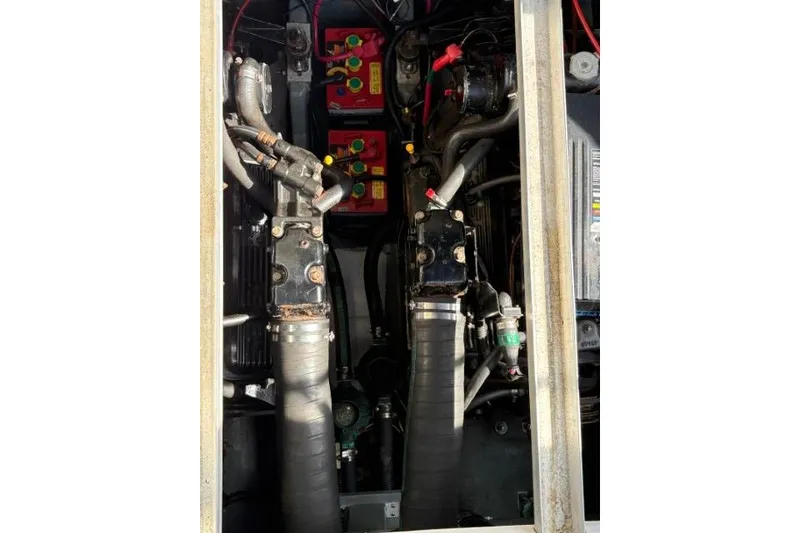 Slide: The Image of Engine compartment of a 1993 Sea Ray Sundancer 330 with visible hoses and components. - 117