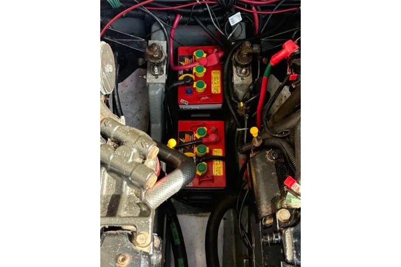 Slide: The Image of Engine compartment of a 1993 Sea Ray Sundancer 330 with visible batteries and wiring. - 118