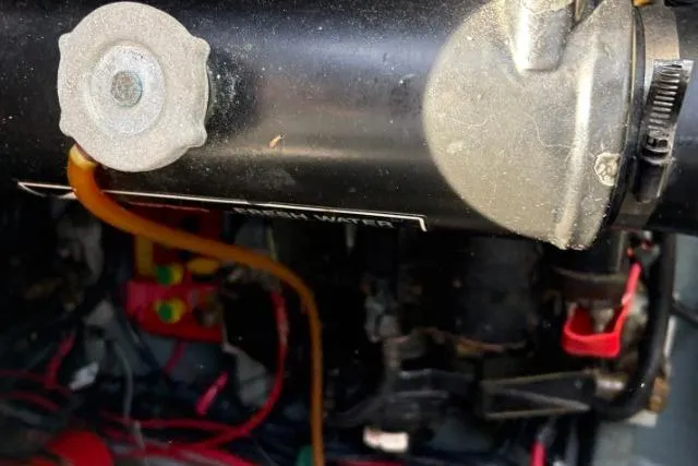 Slide: The Image of Engine compartment of a 1993 Sea Ray Sundancer 330 boat, showing mechanical components and wiring. - 119