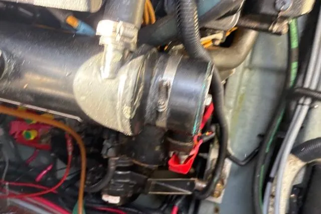 Slide: The Image of Engine compartment of a 1993 Sea Ray Sundancer 330 with visible wiring and components. - 120