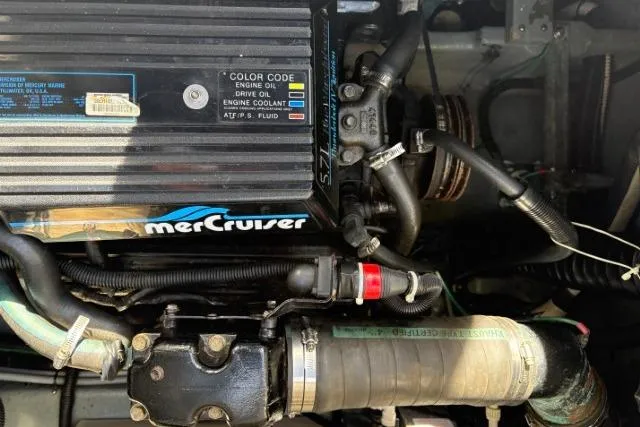 Slide: The Image of Engine compartment of a 1993 Sea Ray Sundancer 330 with MerCruiser components. - 121
