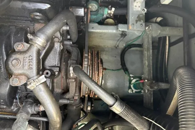 Slide: The Image of Engine compartment of a 1993 Sea Ray Sundancer 330 boat, showcasing mechanical components. - 125