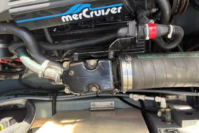 Slide: The Image of Engine compartment of a 1993 Sea Ray Sundancer 330 with MerCruiser components. - 126