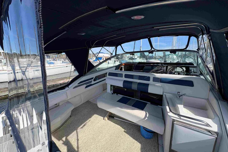 Slide: The Image of Interior view of 1993 Sea Ray Sundancer 330 boat with seating and helm. - 29