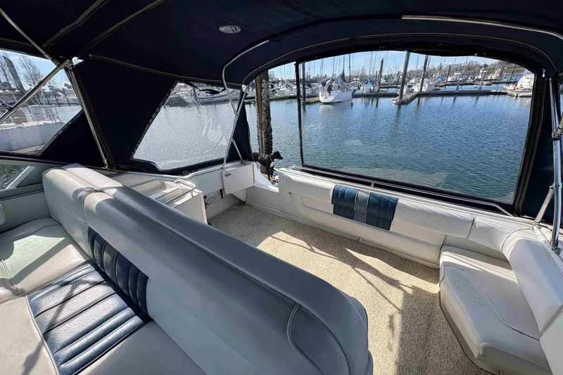 Slide: The Image of Interior view of 1993 Sea Ray Sundancer 330 yacht with marina backdrop. - 44