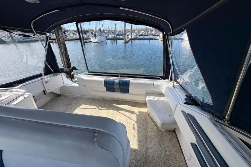 Slide: The Image of Interior view of 1993 Sea Ray Sundancer 330 yacht with marina backdrop. - 45