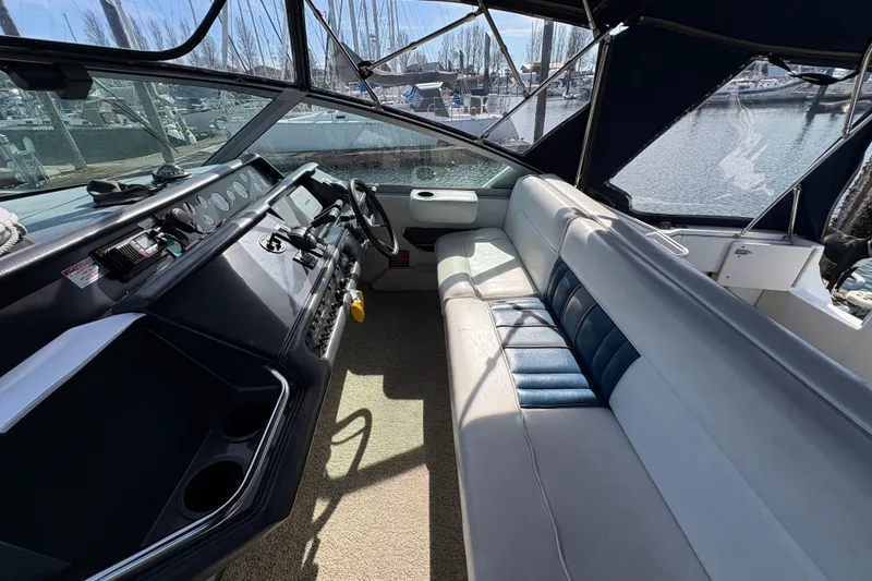 Slide: The Image of Interior view of 1993 Sea Ray Sundancer 330 boat with helm and seating area. - 48