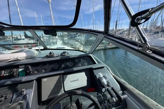 Slide: The Image of Cockpit view of 1993 Sea Ray Sundancer 330 yacht with Garmin navigation system. - 56