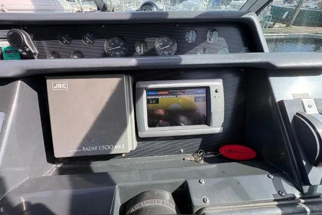 Slide: The Image of 1993 Sea Ray Sundancer 330 dashboard with JRC Radar 1500 MKII and navigation display. - 57