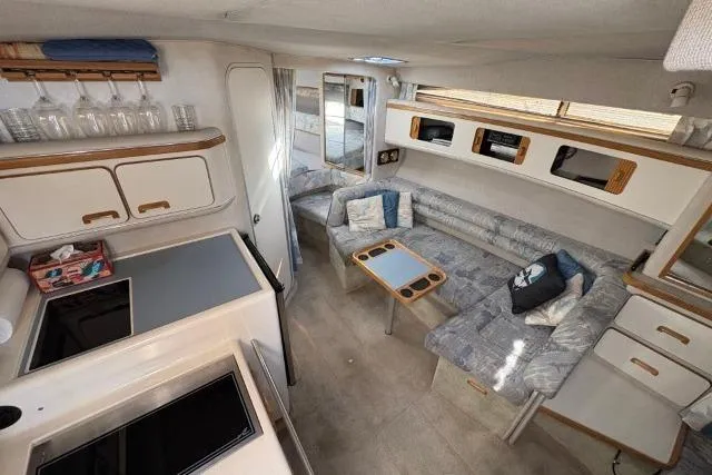 Slide: The Image of Interior of a 1993 Sea Ray Sundancer 330 yacht with cozy seating and modern amenities. - 67