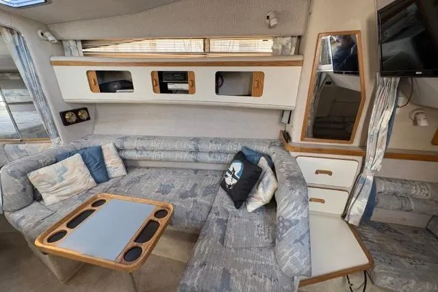 Slide: The Image of Interior of 1993 Sea Ray Sundancer 330 yacht with cozy seating and modern amenities. - 68