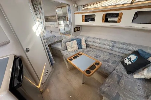 Slide: The Image of Interior of 1993 Sea Ray Sundancer 330 yacht with cozy seating and modern amenities. - 70