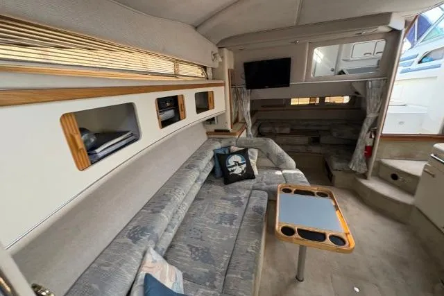 Slide: The Image of Interior of 1993 Sea Ray Sundancer 330 yacht with cozy seating and modern amenities. - 81
